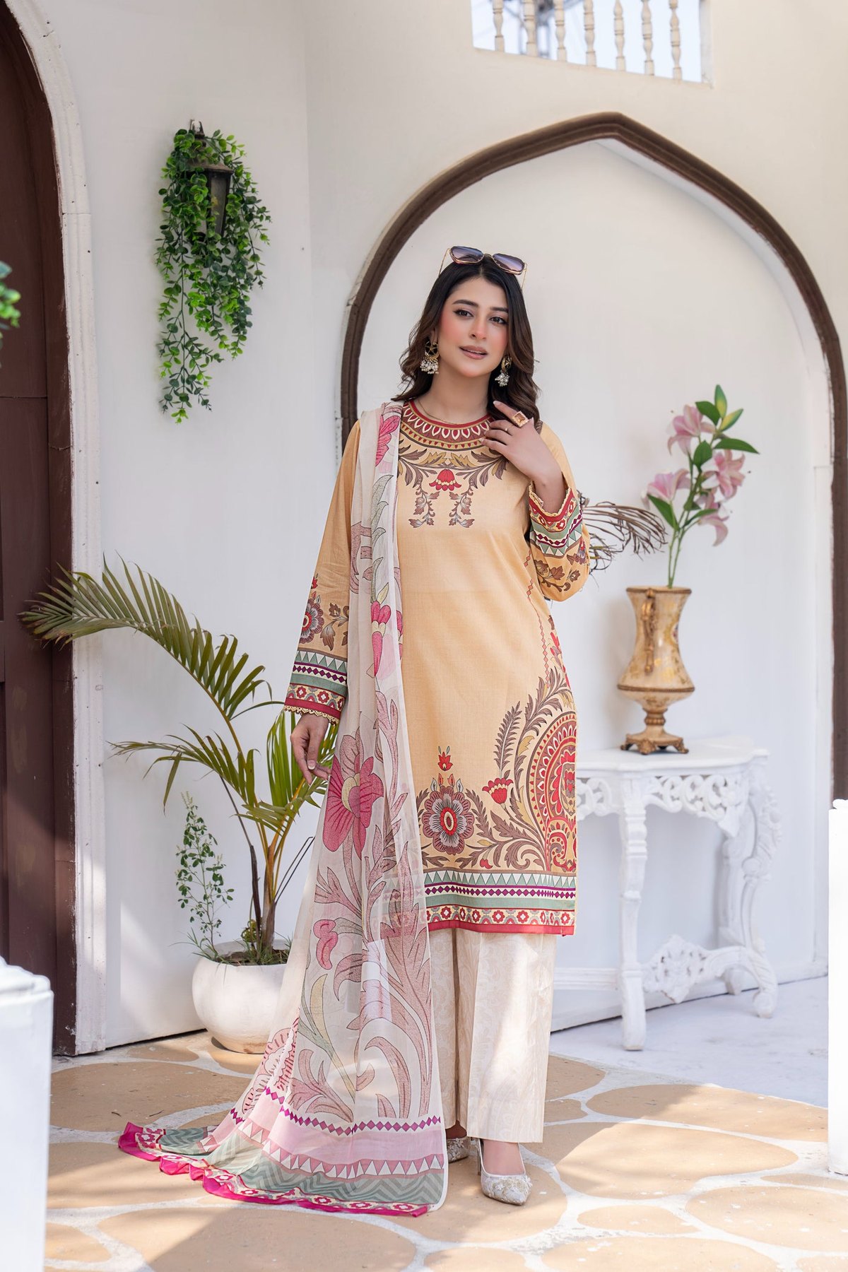 Peach three piece lawn suit with an embroidered front and printed dupatta