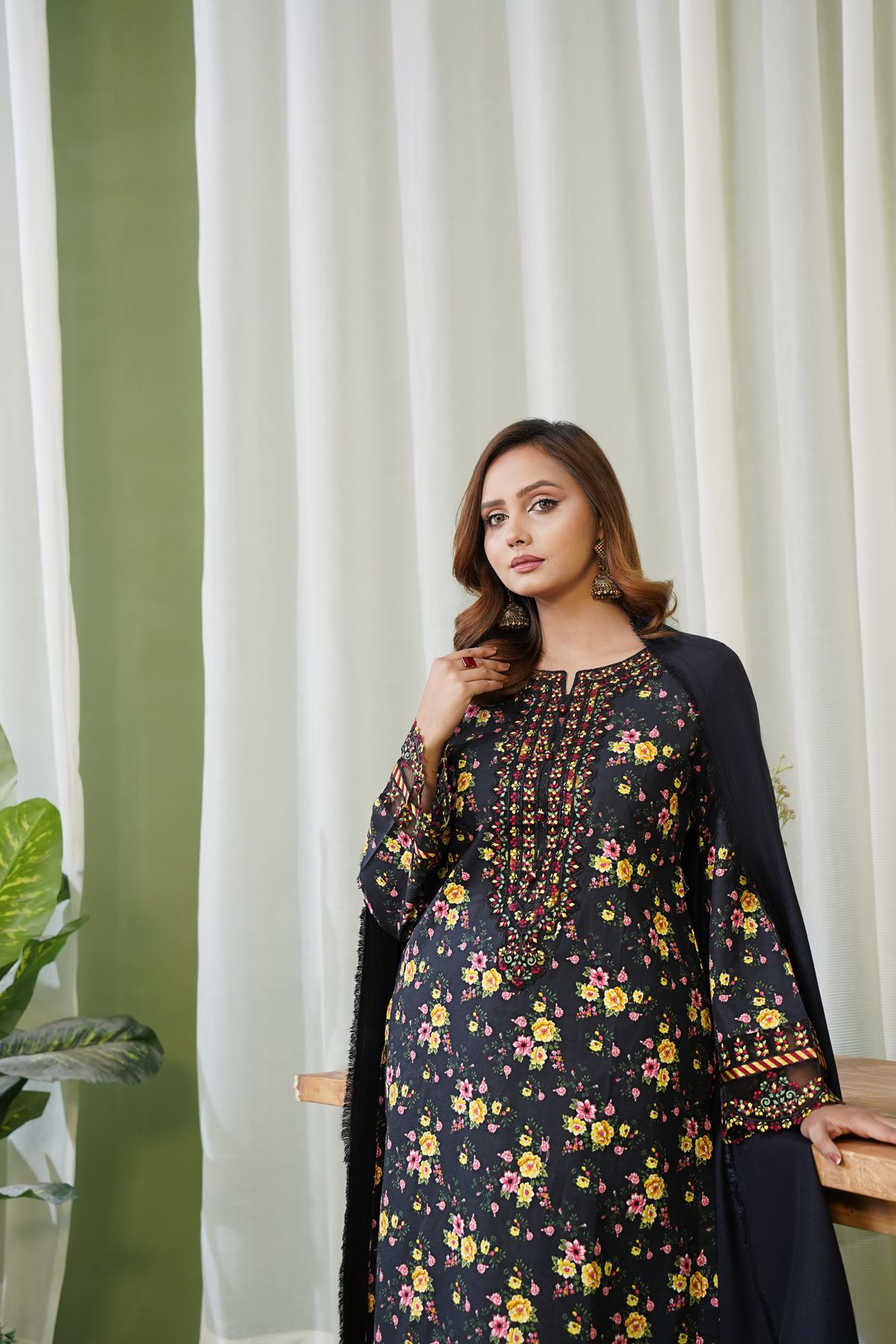 Black Pakistani ladies suit with all over embroidered detail
